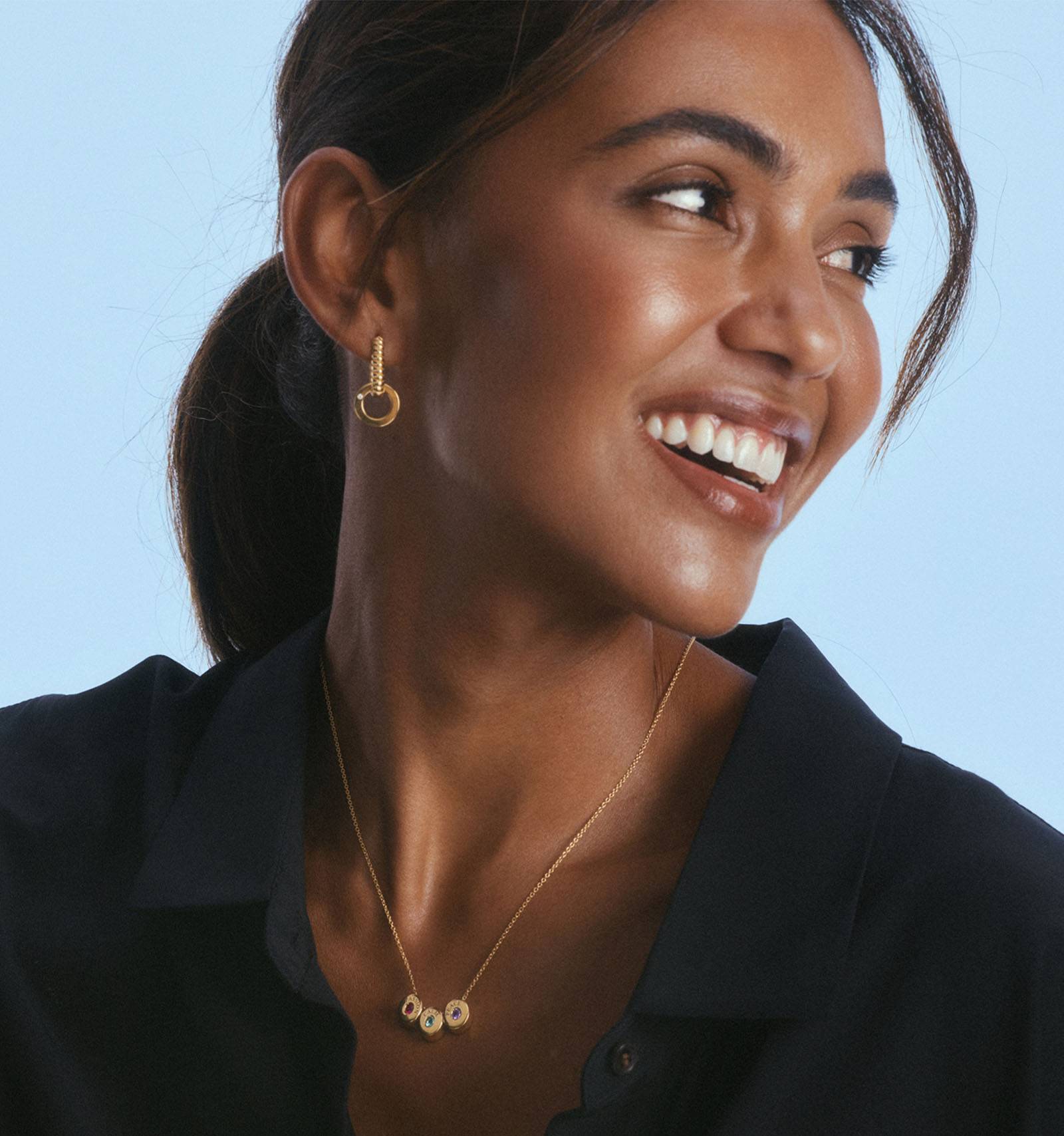 Smiling woman wearing necklaces